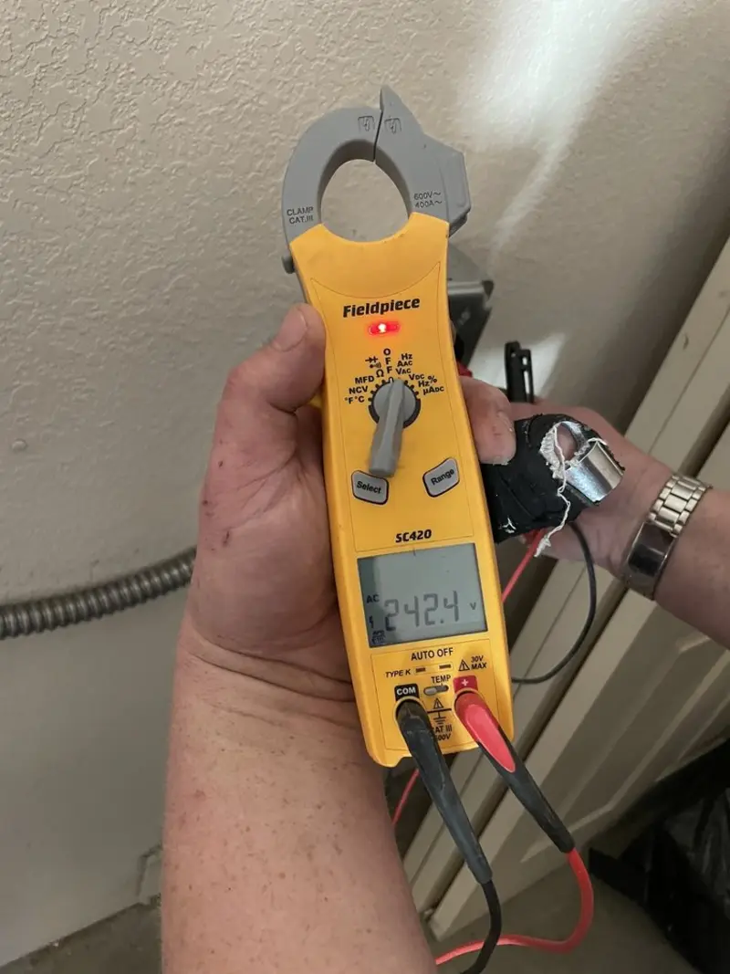 Voltage testing with clamp meter during Recessed Lighting Installation in Westampton
